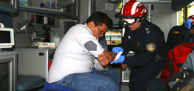 A paramedic provides medical attention (Simulation)