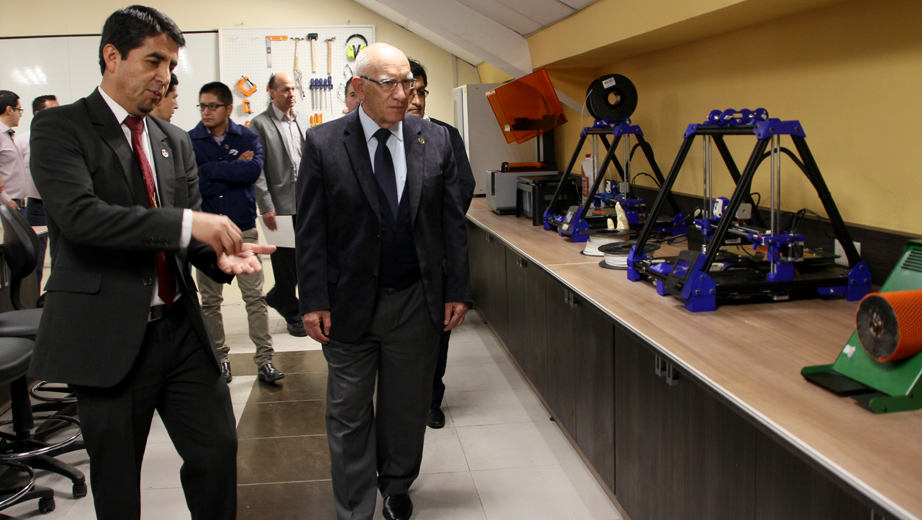 UPS officials and professors in the lab